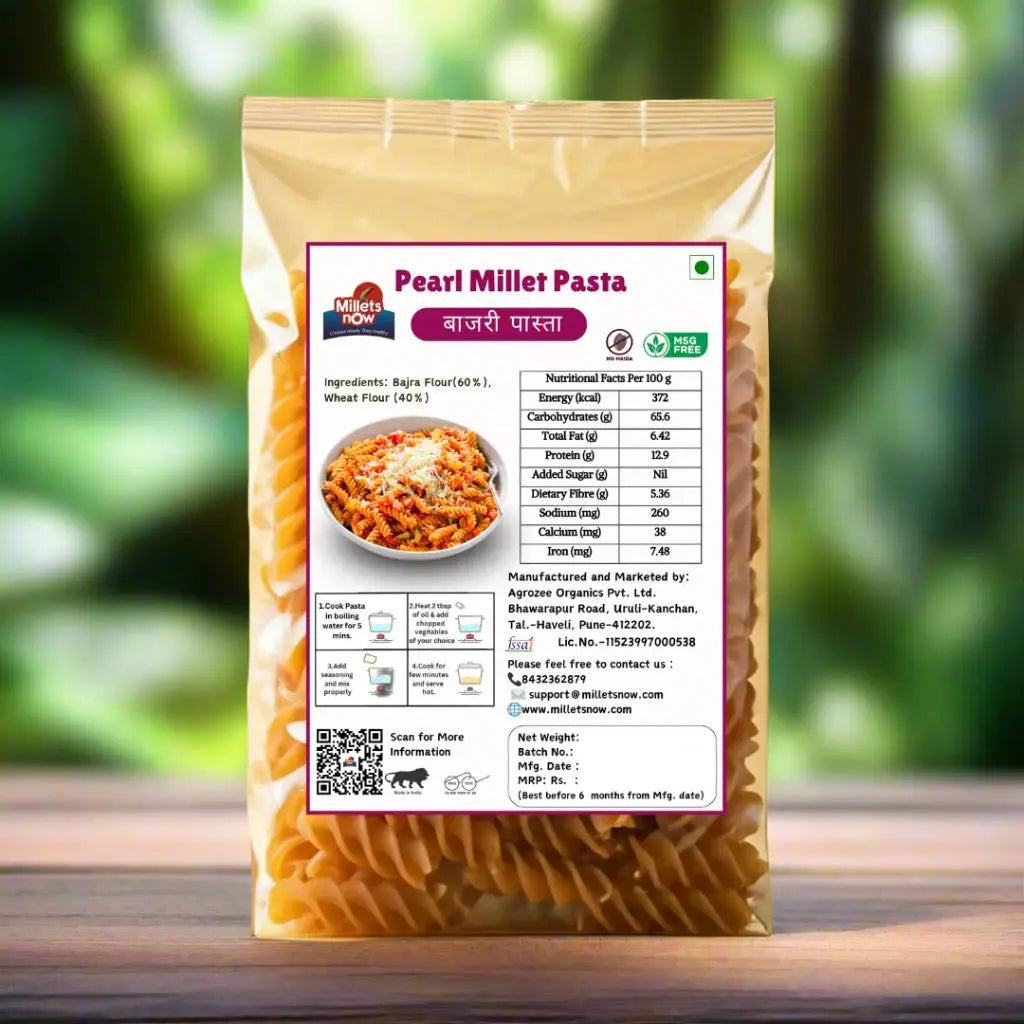 Packaged pearl millet pasta with a label on a beige background